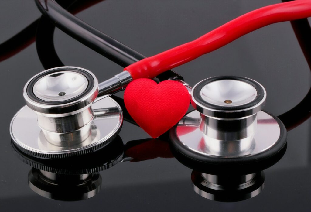 a stethoscope and a heart on a table